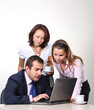 Three colleagues working at a computer. Three colleagues working at a computer.