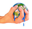 The hand compressing earth planet isolated The hand compressing earth planet isolated