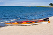 Colorful canoes on a sandy beach