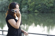 Latin brunette girl speaking on a cellphone outdoor