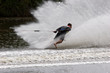 A barefoot waterskier going backwards