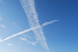 Clouds kiss across a blue sky