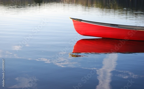 Photo: Red Canoe reflection in lake in Algonquin Park Red Canoe reflection in lake in Algonquin Park