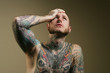 Tattoo man with headache