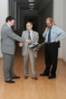 Businessmans conversation. Two pro and one amateur man