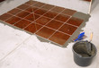 floor with ceramic tiles and plaster bucket