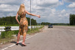 Young woman stopping the car.