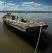 Abandoned boat rising with the tide at Heswall shore Abandoned boat rising with the tide at Heswall shore
