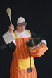 Middle aged nun with bad eye sight preparing food. Middle aged nun with bad eye sight preparing food.