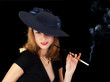 Young smiling woman in black, smoking a cigarette in style Young smiling woman in black, smoking a cigarette in style