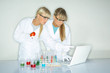 Beautiful female lab workers testing and experimenting