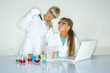 Beautiful female lab workers testing and experimenting