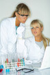 Beautiful female lab workers testing and experimenting