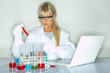 Beautifula female lab worker testing and experimenting