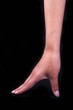 Foto: A high-heeled shoe gesture in black isolated background. A high-heeled shoe gesture in black isolated background.