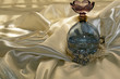 Blue perfume bottle with pearls on satin Blue perfume bottle with pearls on satin
