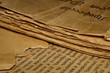 Closeup of an old book with tattered pages and slavonic text