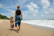 Photo: Walking along the beach Walking along the beach
