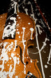 Old grunge violin spattered with white paint without strings in