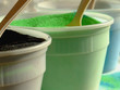 Green and black colored sand