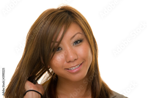 Photo: Asian Woman Straightening Hair Asian Woman Straightening Hair