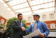  business man and architect Shaking Hands