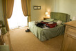 hotel suite with open suitcase hotel suite with open suitcase