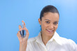 young pretty girl holding perfume