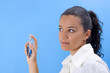 young pretty girl holding perfume