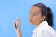 young pretty girl holding perfume