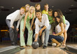 Teenagers playing bowling