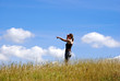 Girl pointing in meadow