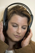 Beautiful girl listening to music with headphones