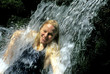 woman under waterfall