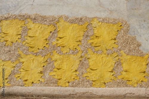 Yellow leather dries on roof of city Fez