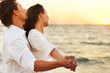Young couple looking at the sunset