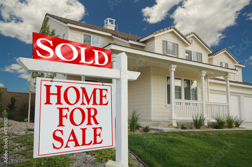 Photo: Home For Sale Sign in Front of Beautiful New Home Home For Sale Sign in Front of Beautiful New Home