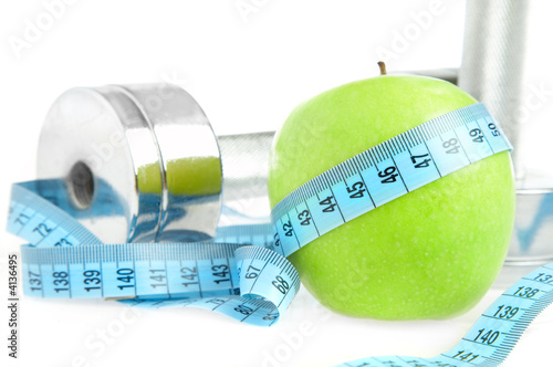 Foto: Dumbbells and apple. A healthy way of life Dumbbells and apple. A healthy way of life