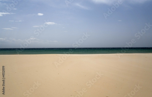 Sandy beach in Spain. Sky and clouds.