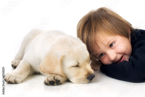 Photo: Child next to puppy Child next to puppy