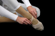 Ballerina tying her shoe Ballerina tying her shoe