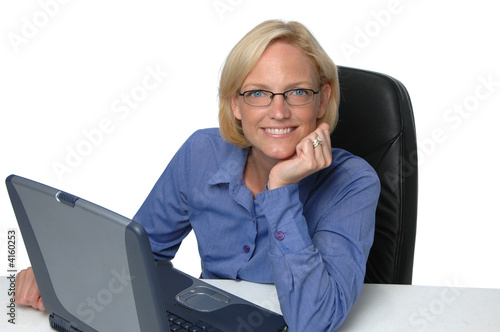 Businesswoman with laptop at desk