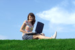 Teen girl in outdoor study with a laptop