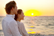 Portrait of young couple looking at the sunset
