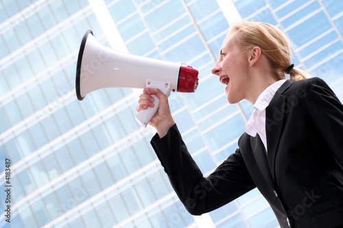 Businesswoman Shouting Through Megaphone