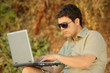 Person working on a laptop outdoors