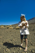 Girl on rim of volcano caldera