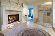 opulent bathroom with fireplace and marble