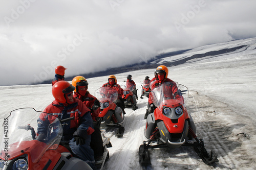 Photo: people on snowmobiles on glacier people on snowmobiles on glacier