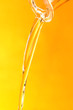 Jet of oil on a yellow background